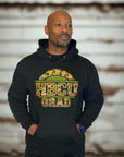 Model wearing a black Proud HBCU Grad hoodie with a handcrafted camo chenille patch, varsity-style stitched lettering.