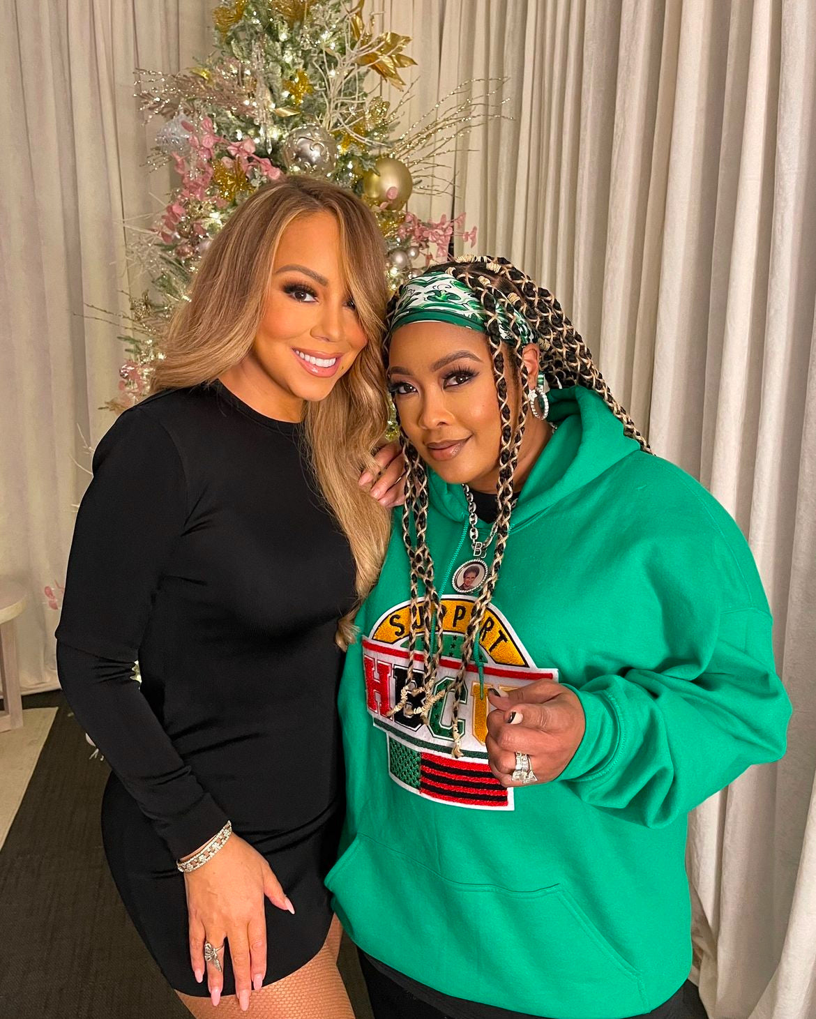 DABRAT wearing the SUPPORT HBCUs hoodie next to Mariah Carey. 