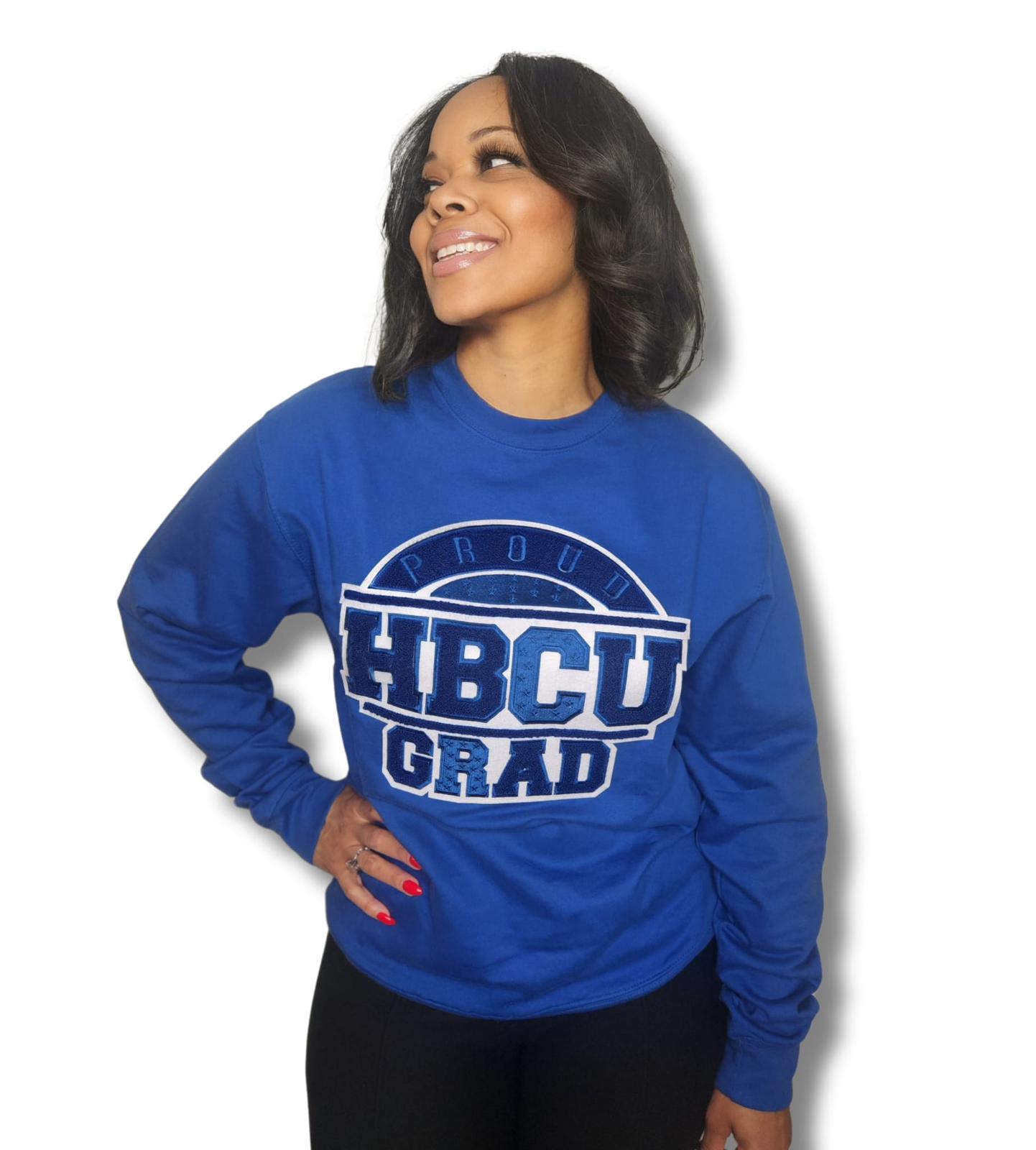 "Collegiate-inspired Proud HBCU Grad sweater in royal blue with a royal blue and white hand-stitched chenille patch."