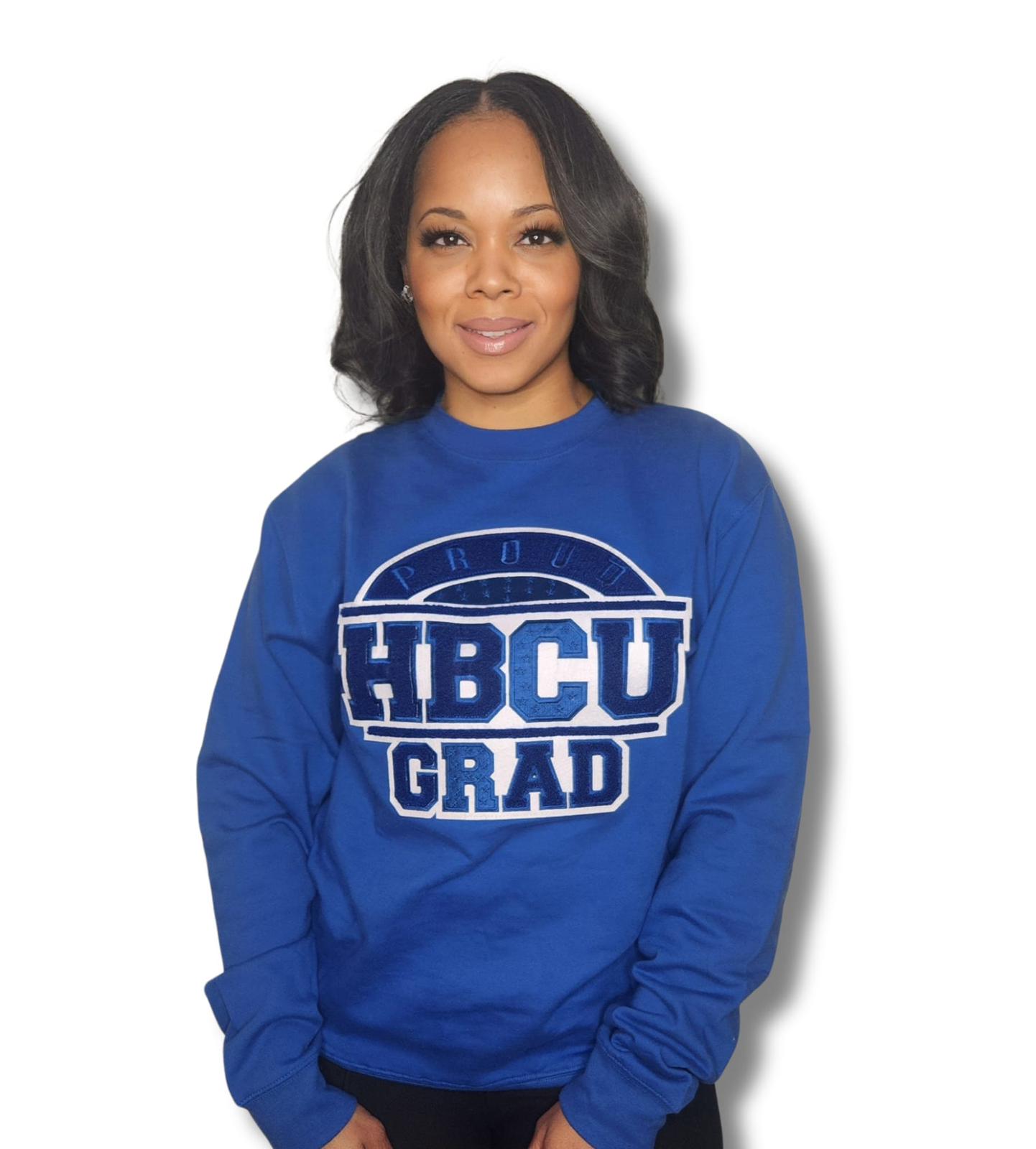 "Collegiate-inspired Proud HBCU Grad sweater in royal blue with a royal blue and white hand-stitched chenille patch."