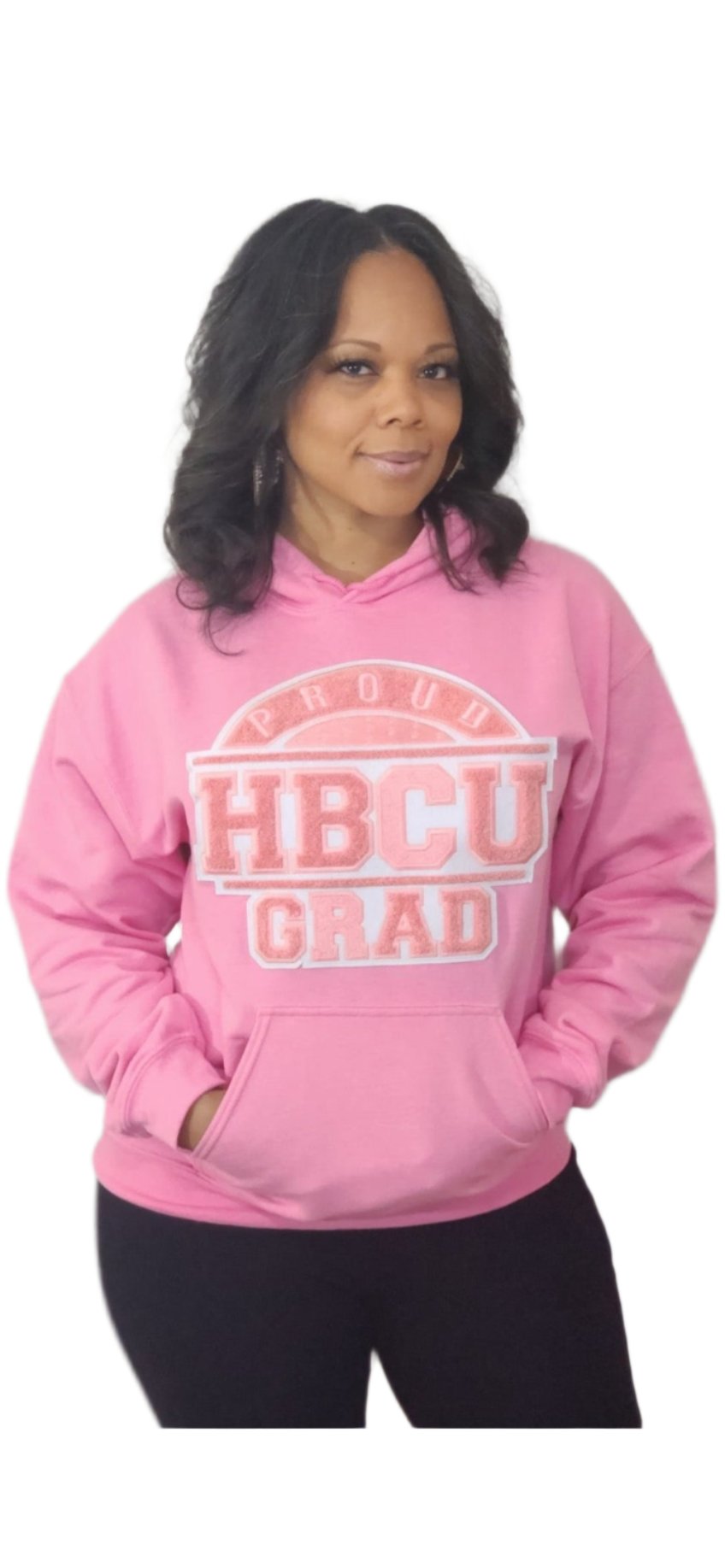 Woman wearing a pink and white PROUD HBCU GRAD.